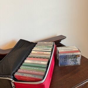 25 Christmas cassettes W/ Case-Logic Case: Hallmark, Victoria Secret And More!